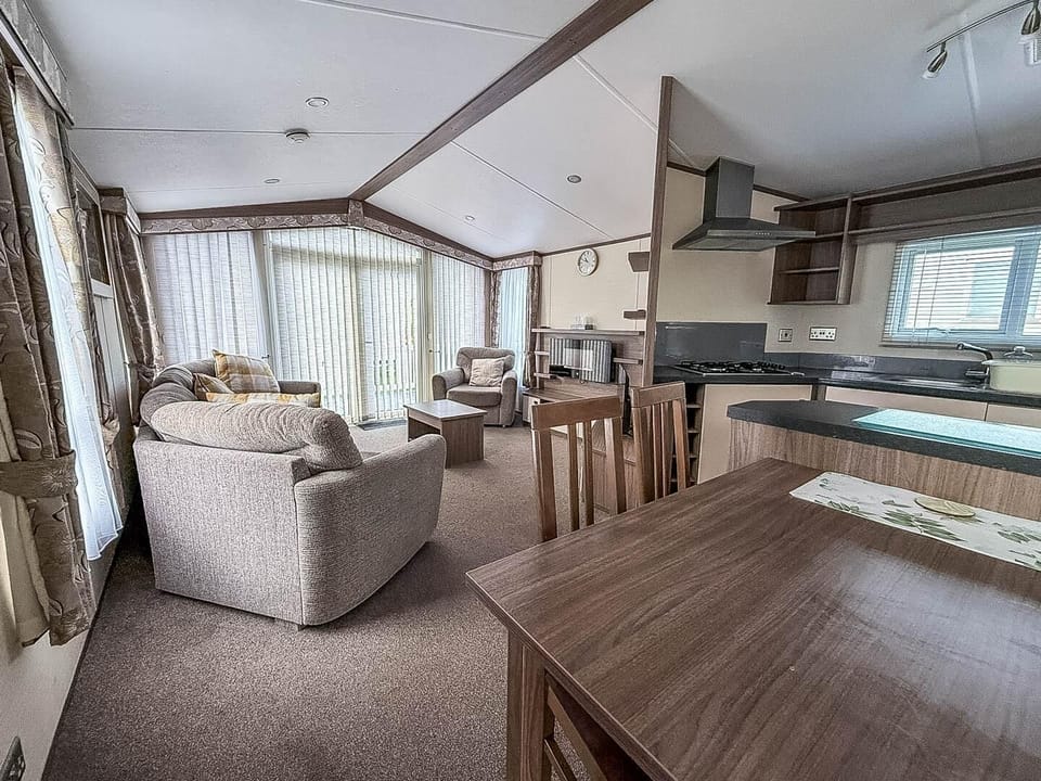 Bright open living and dining area with panoramic windows