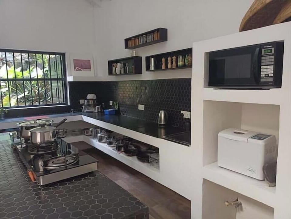 The large kitchen provides ample space to  prepare and cook for 16 adult guests
