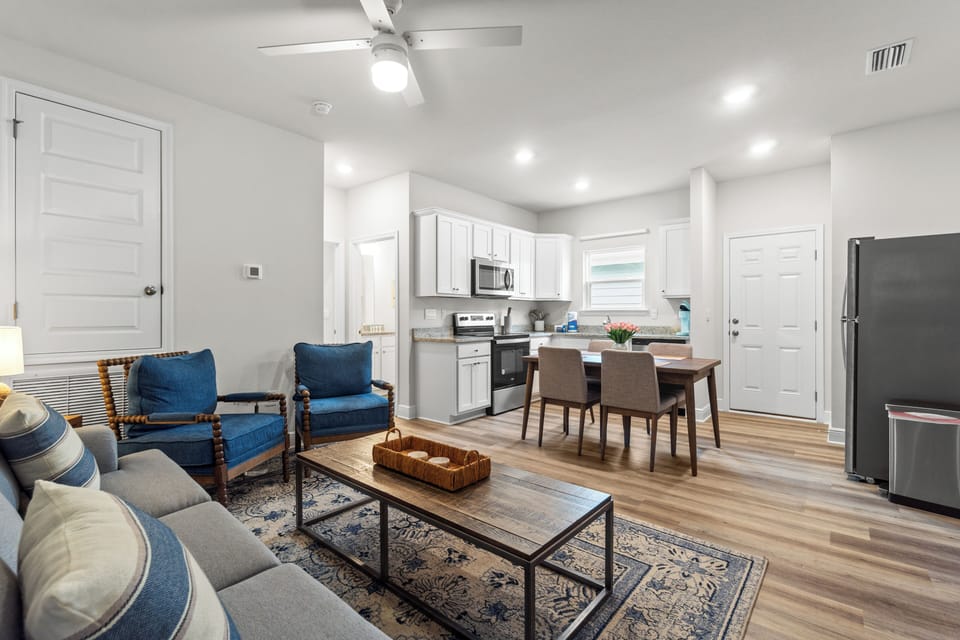 Unwind in your stylish open-concept retreat where coastal blues meet modern comfort, complete with a fully equipped kitchen for home-cooked meals.
