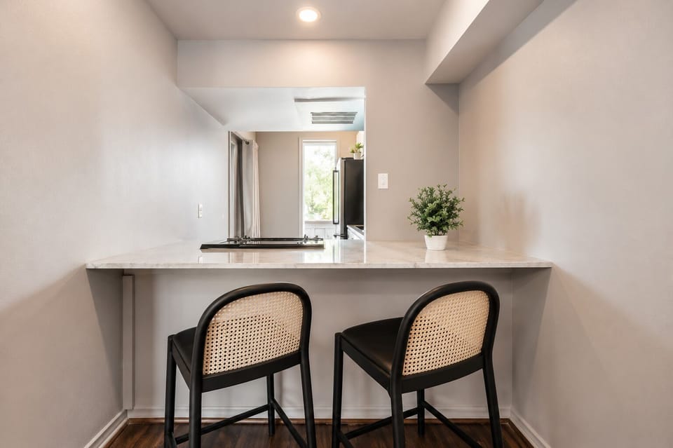 Stylish bar seating at the bar, perfect for casual meals or chatting with the chef.