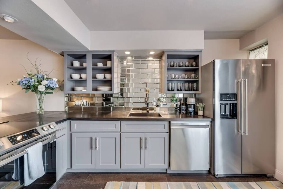 Spacious kitchen with sleek, modern appliances, fully equipped for all your cooking and dining needs.