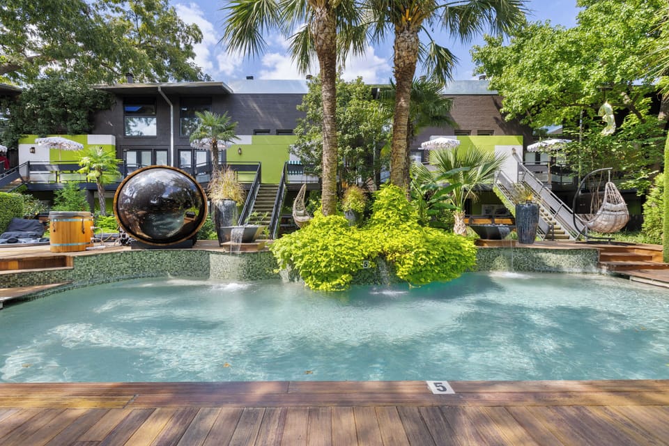 Architectural landscaping blending water, greenery, and wellness design