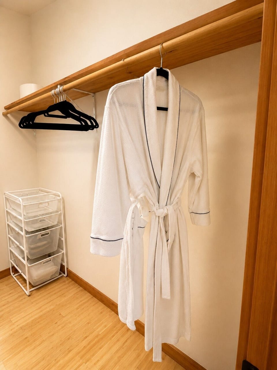 Convenient closet space with plush robes, hangers, and guest storage