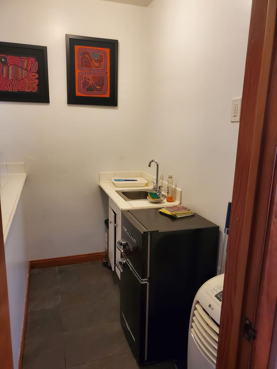 Kitchenette - mini-fridge and sink.  No stove.