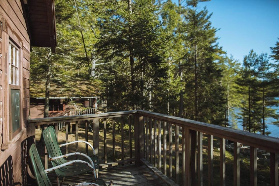 Cabin 3 Porch with shaded canopy and lake views. 
