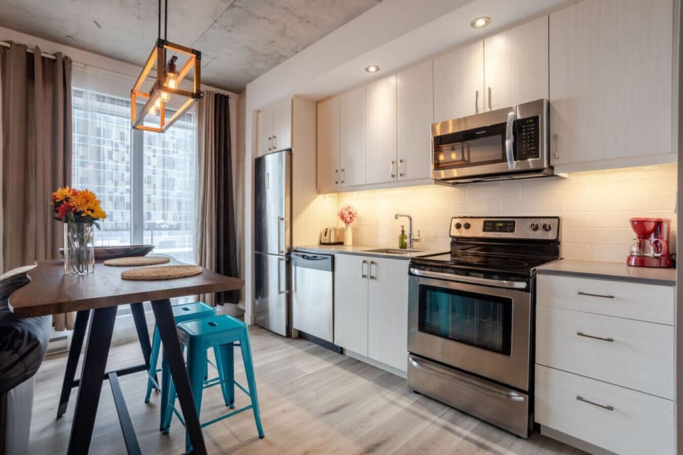 Fully equipped kitchen with bright, inviting dining nook.