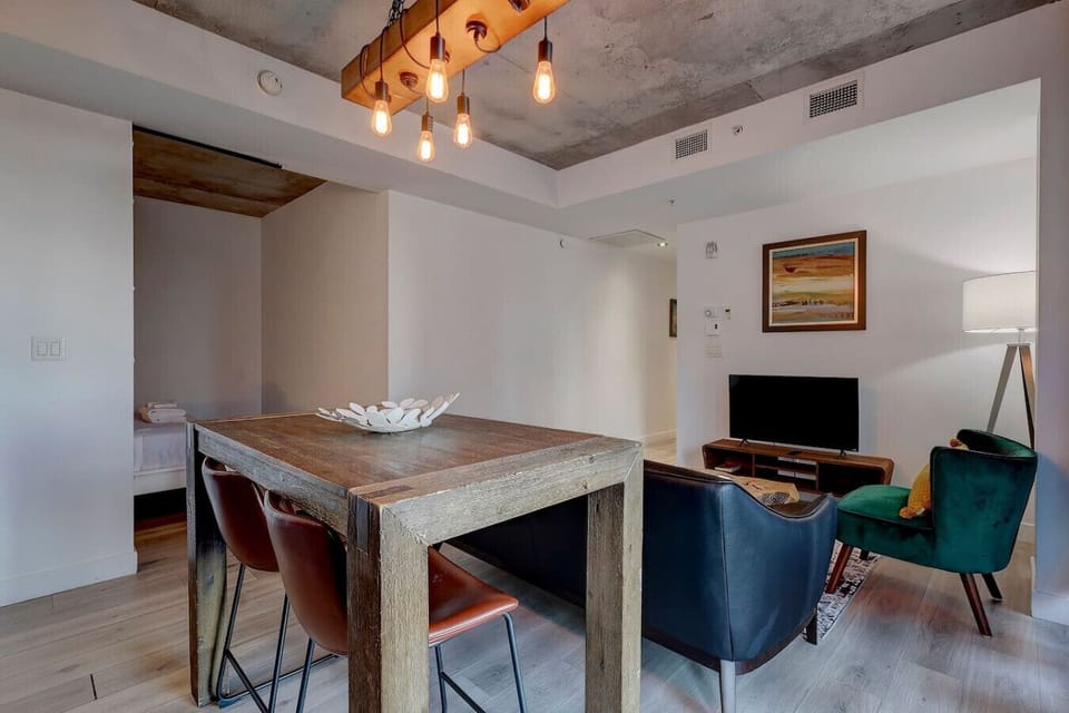 A refined dining area with warm lighting and a cozy atmosphere, ideal for gatherings and intimate meals.