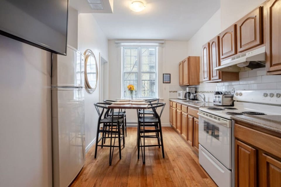 Kitchen: Warm wood tones, generous counter space, and a full setup make it easy to cook and gather