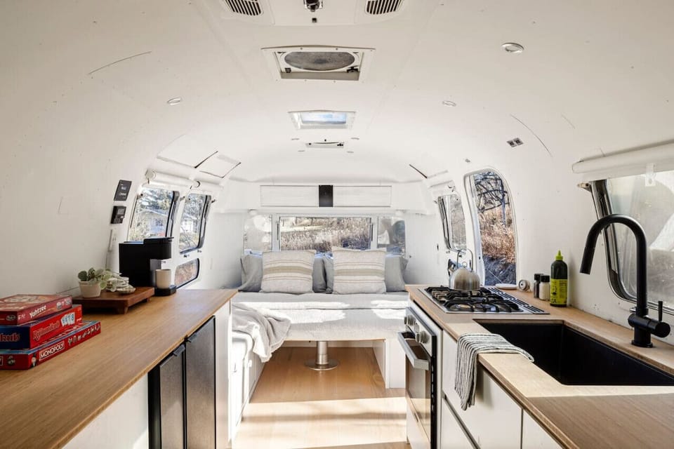 Cozy interior with kitchen and sleeping area.