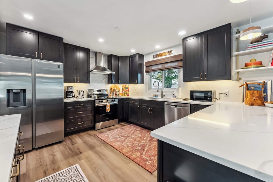Kitchen: Fully equipped with drip coffee maker, Crockpot, French press, and Samsung appliances, main floor