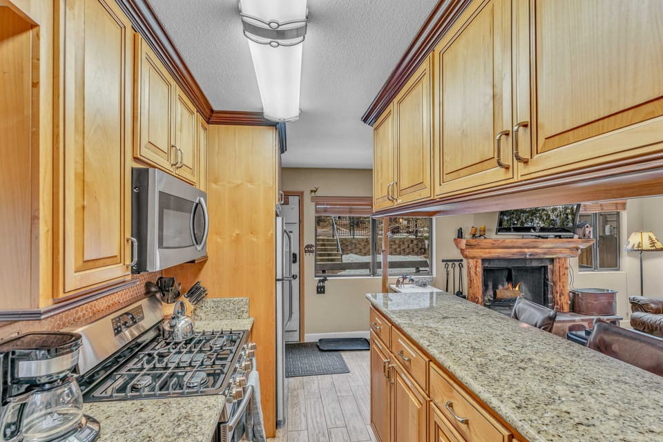 Kitchen: Main floor, drip coffee maker, Crockpot, toaster, cooking utensils