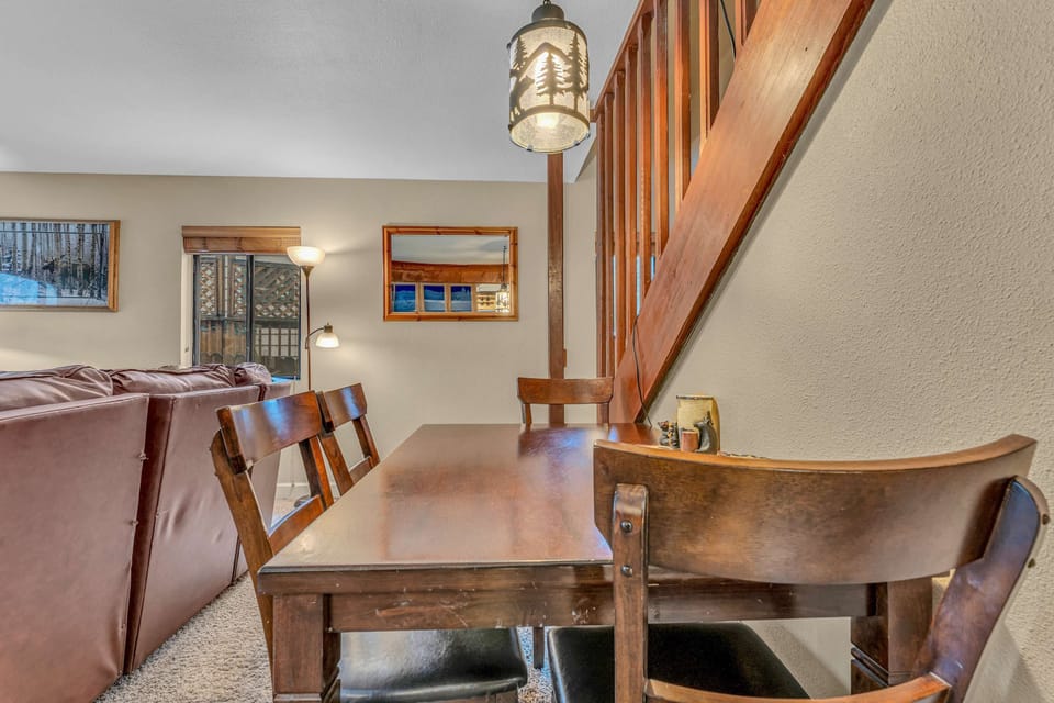 Dining Area: Main floor, table seating for 4, bar seating for 3