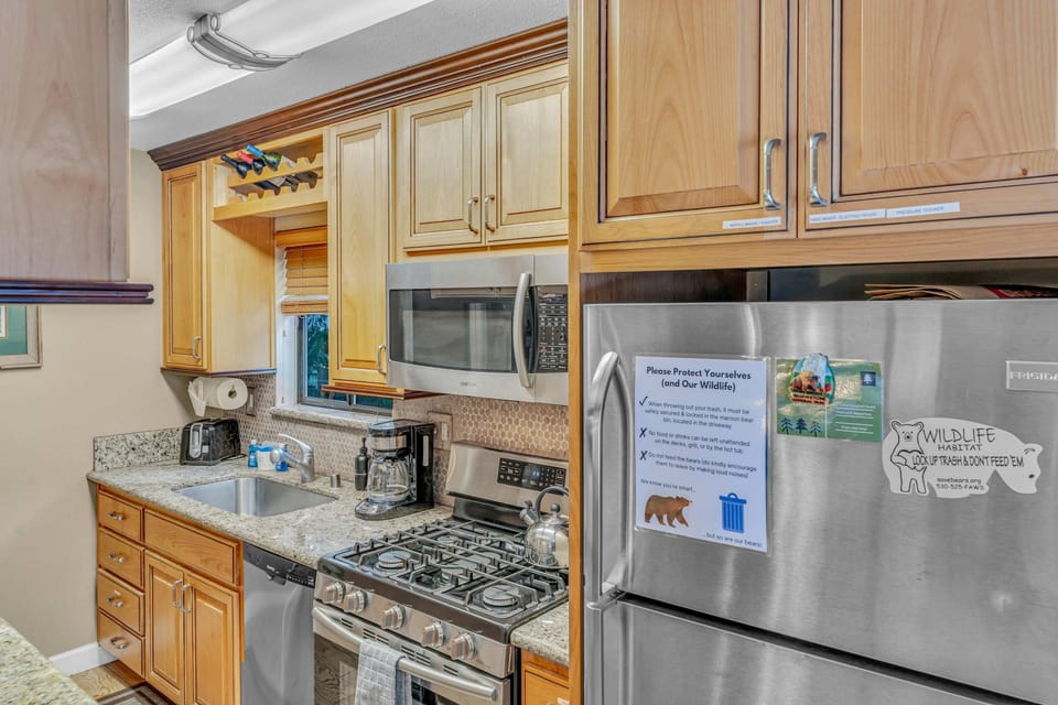Kitchen: Main floor, drip coffee maker, Crockpot, toaster, cooking utensils