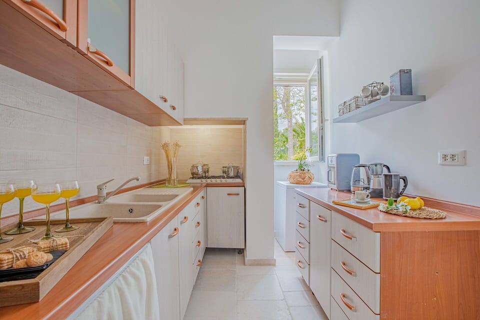 Countertop, Kitchen, Flooring, Interior Design, Home, Kitchen Sink, Plumbing Fixture, Cabinetry, Furniture, Floor