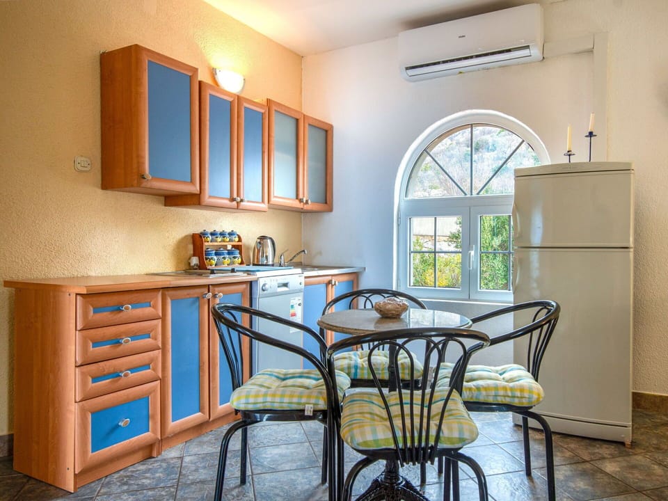 Furniture, Interior Design, Flooring, Kitchen, Floor, Major Appliance, Countertop, Chair, Lighting, Kitchen Appliance