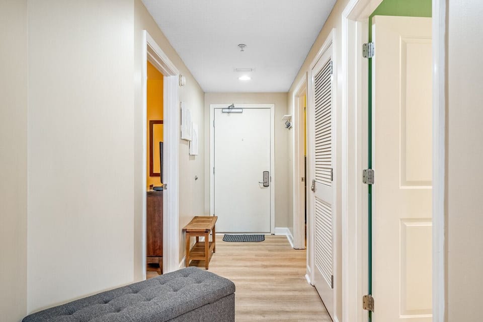 Step into a stylish and welcoming entryway at this beautifully designed beachfront condo