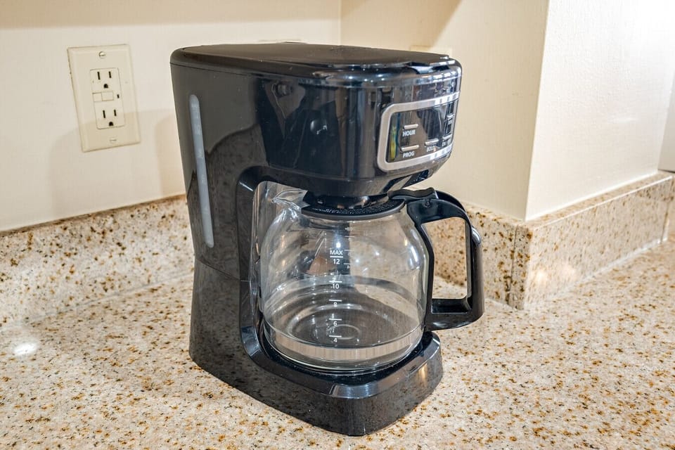 Start your mornings right with this convenient coffee maker, perfect for brewing a fresh cup of coffee to enjoy on the balcony with stunning views