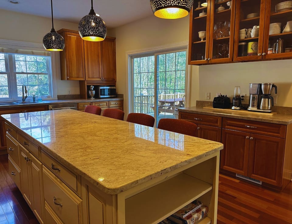 Oversized Island features four comfy bar stools.