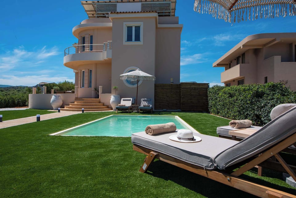Private Pool and Sun Loungers on Lush Green Lawn