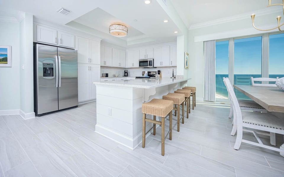Sip your morning coffee at the breakfast bar and get ready for a beach day in this stylish space