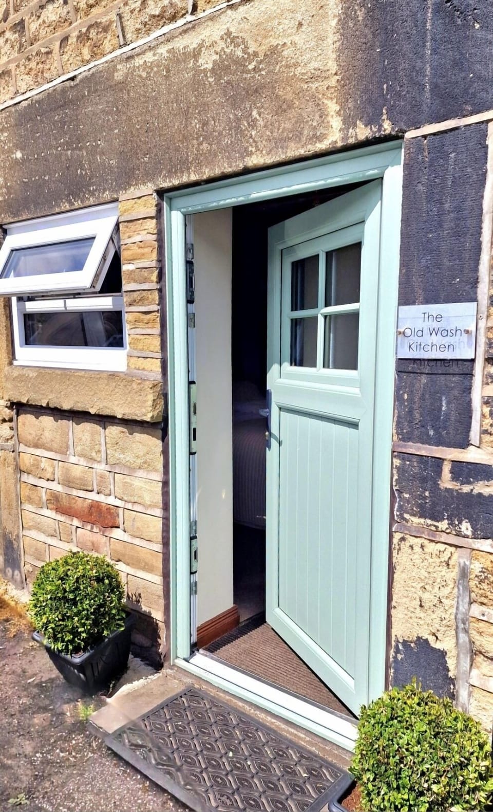 Entrance from the riverside lane