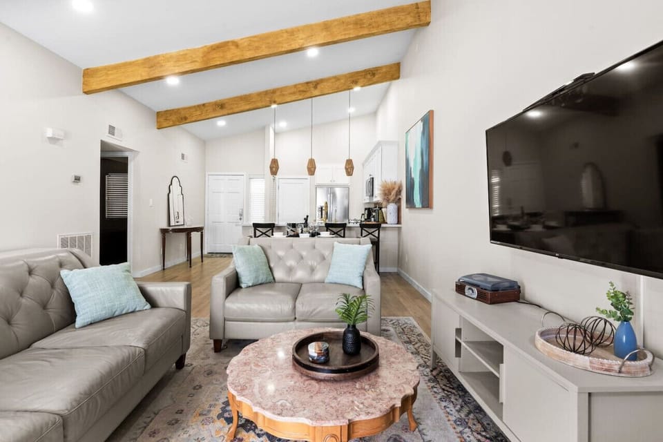 This open-concept living room provides ample seating, perfect for game nights or chill evenings.