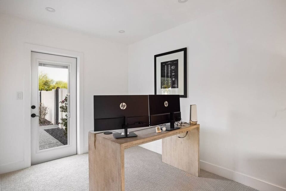 Dedicated workspace area with dual monitors—perfect for remote work or planning your day.