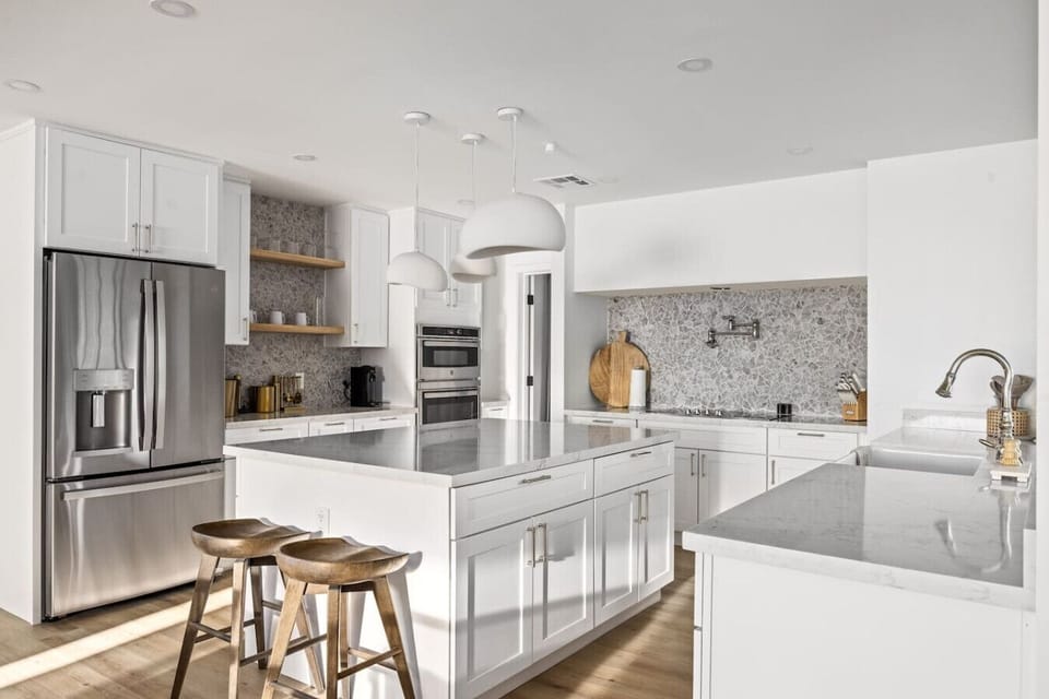 Bright and modern kitchen with sleek finishes and plenty of space to cook and gather.
