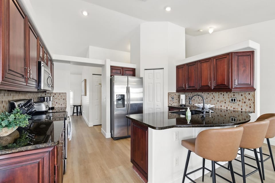 Fully stocked kitchen with bar seating