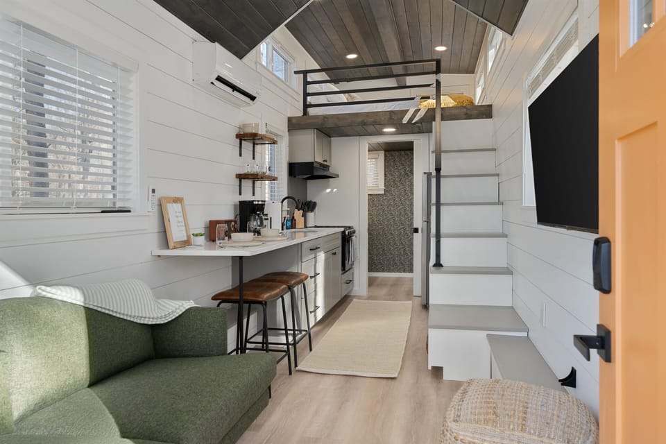 The perfect space for two—enjoy relaxed mornings with breakfast at the bar, cozy up for a movie night, or simply unwind together in this thoughtfully designed retreat.