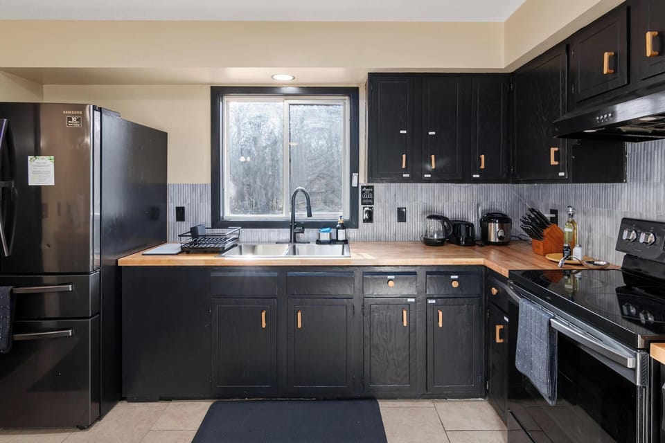 Another view of fully stocked kitchen, with stove and oven