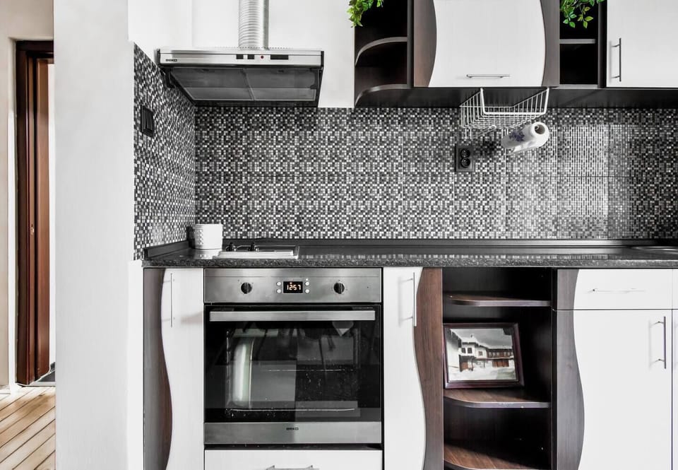 Prepare your favorite dishes in this well-appointed kitchen, complete with a stylish backsplash and all the essentials.