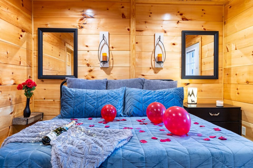 Cozy up in this king-sized bed with soft linens, perfect for a romantic getaway.