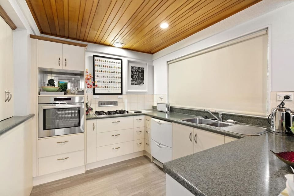 Modern kitchen with dishwasher, full size fridge and modern appliances