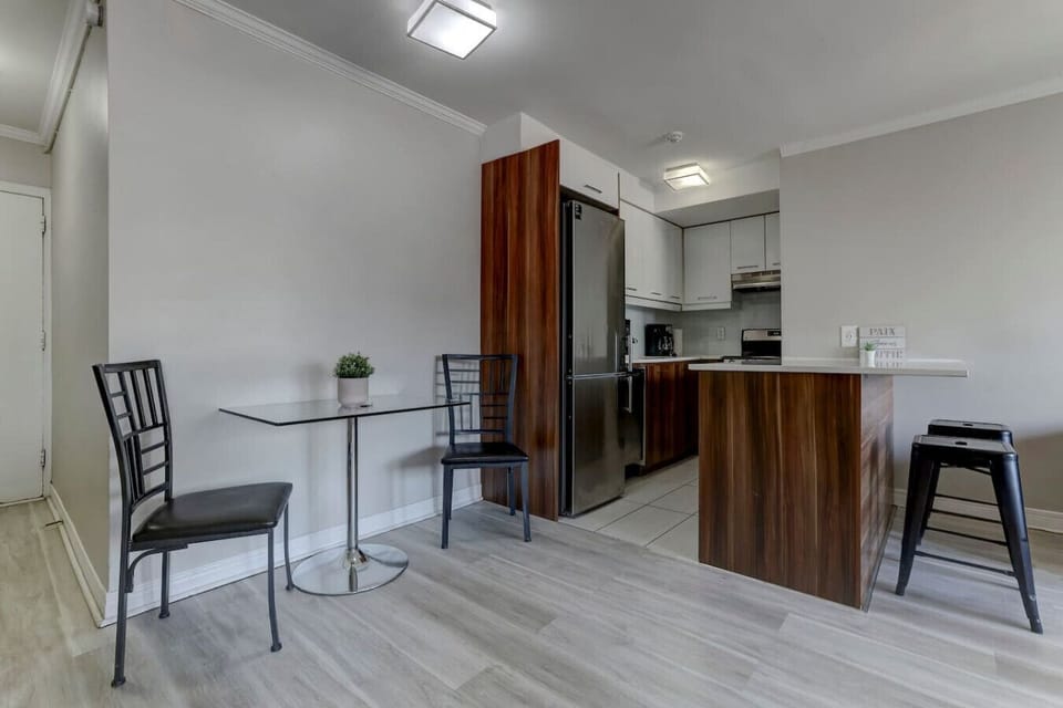 A modern and functional dining space with a sleek kitchen and stylish finishes