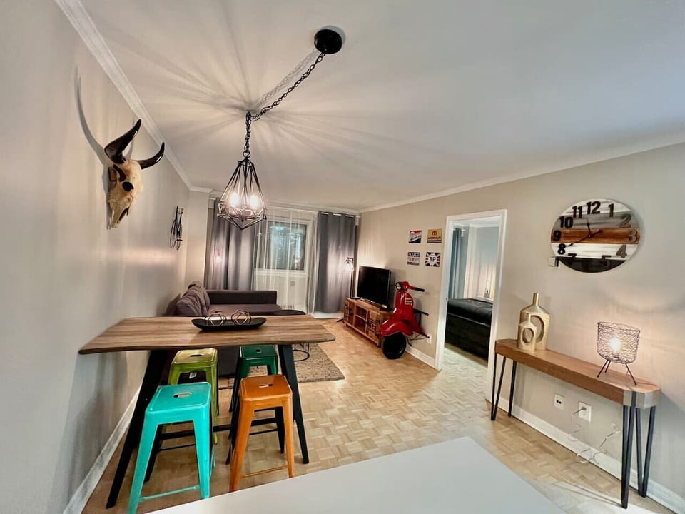 A rustic dining space with industrial-inspired lighting and a charming bar area.