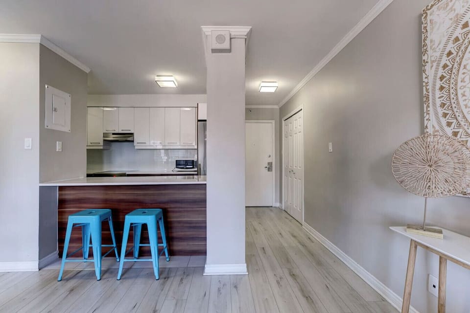 A seamless transition from the dining area to the fully equipped kitchen, offering a modern and functional layout.