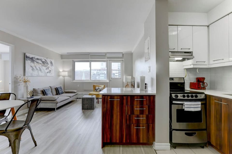 modern and open kitchen with sleek cabinetry, rich wood accents, and a spacious layout.