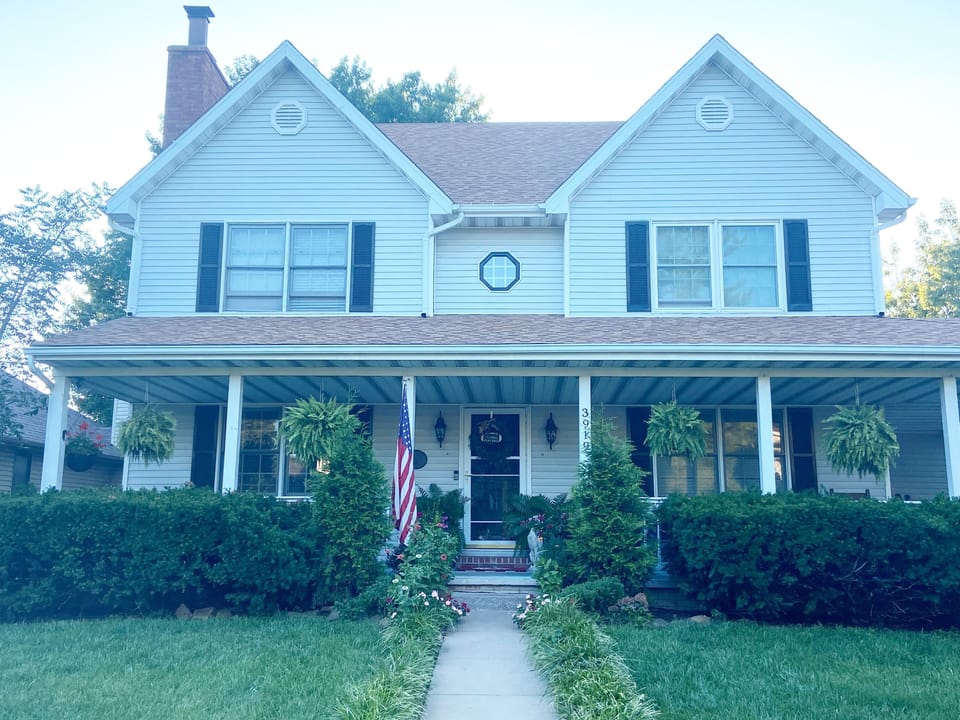 The front of the entire house. Private guest entrance on the south side (left).