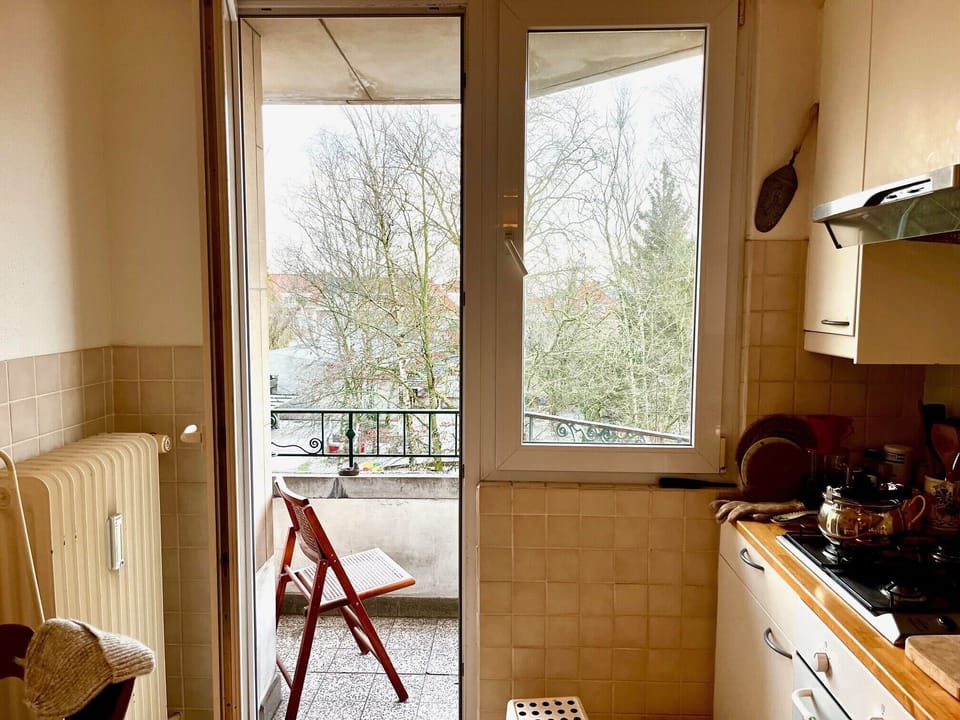 from kitchen out to patio -- breakfast spot for one!