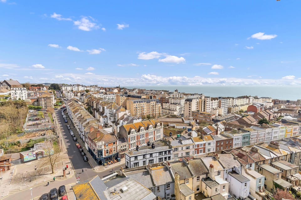 Coastal view from the apartment’s window, overlooking the seafront and promenade