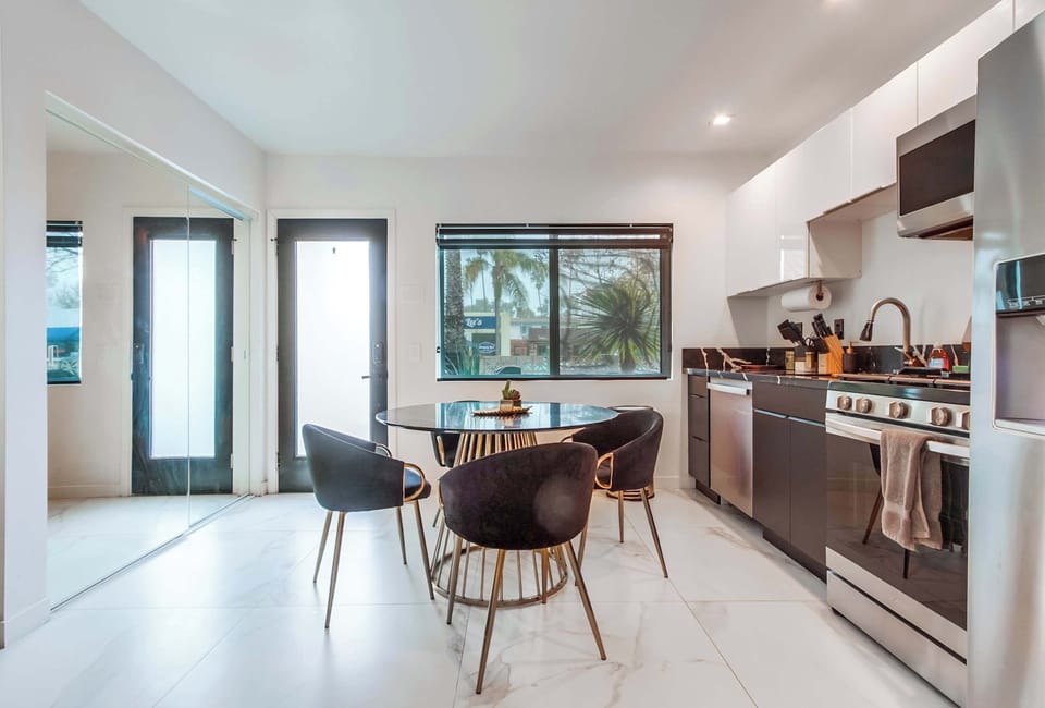Full kitchen with a refrigerator, freezer, dishwasher