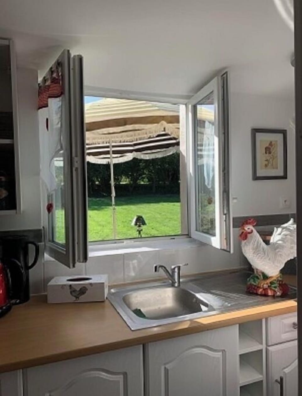 View out of kitchen window on to rear patio area.