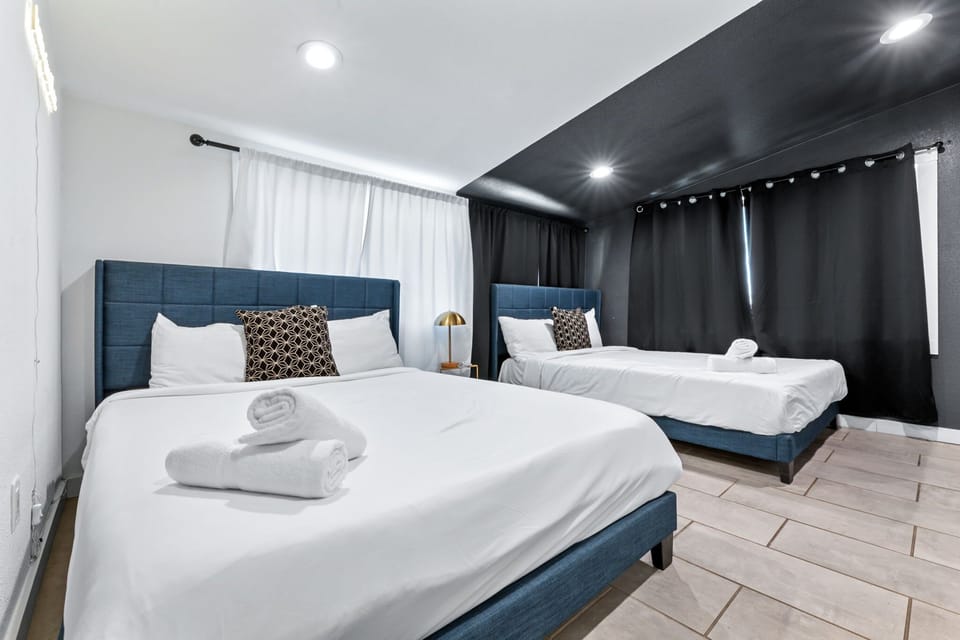 Bedroom 4 with 2 queen beds and ensuite