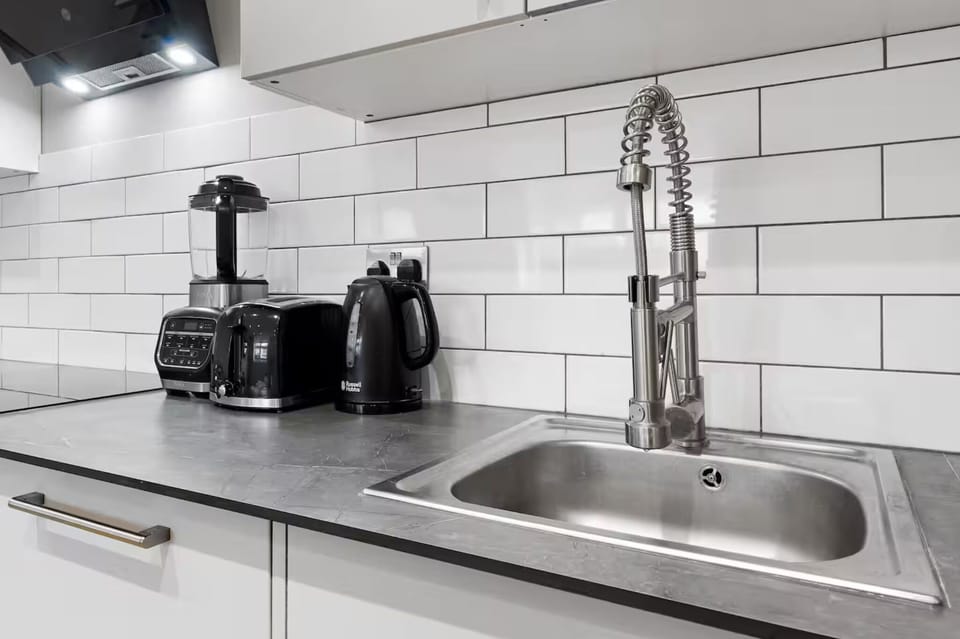 Sleek kitchen island and breakfast setup for quick bites or coffee.