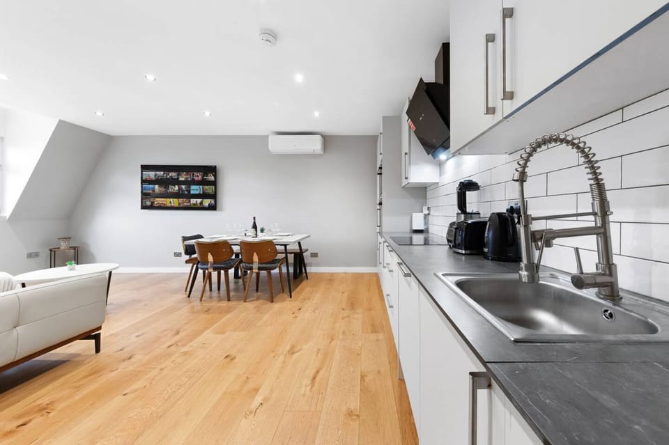 Wide shot kitchen and dining. Modern, self-catering vacation rental.
