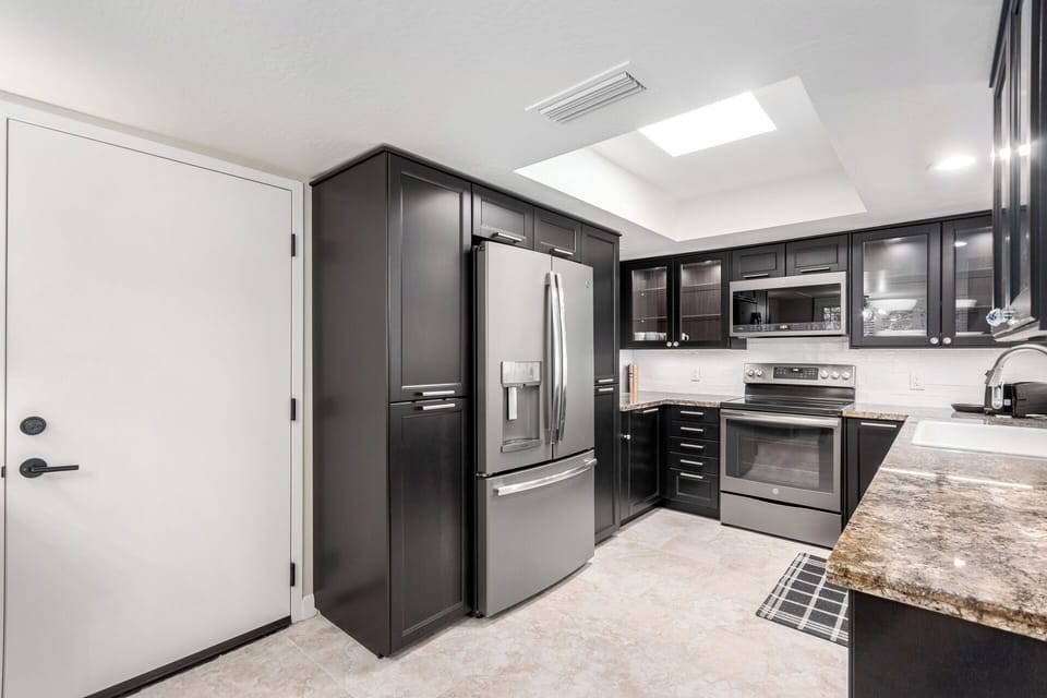 Kitchen just inside the home off of garage