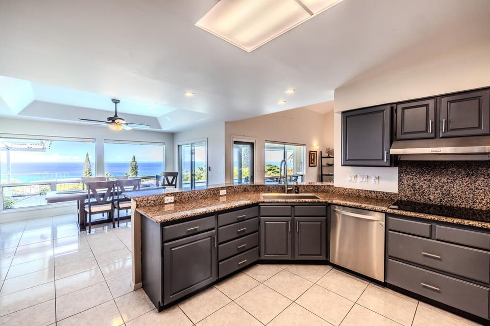 Kitchen area is offering serene view of the pool & ocean