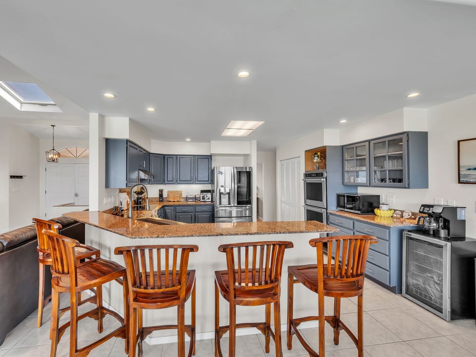 Kitchen area is offering serene view of the pool & ocean