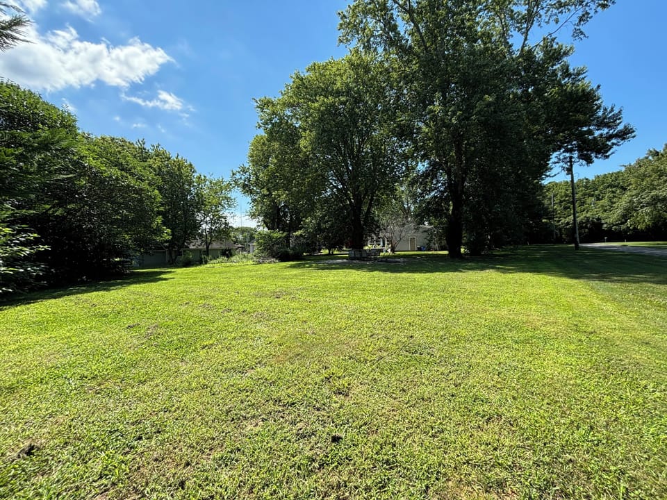 Backyard is spacious with room to relax and enjoy this quiet neighborhood